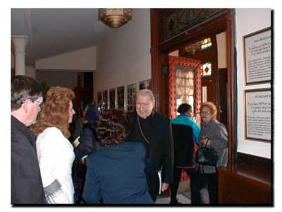 Picture of Cardinal O'Connor entering St. Cecilia's Church and greeting parishioners.