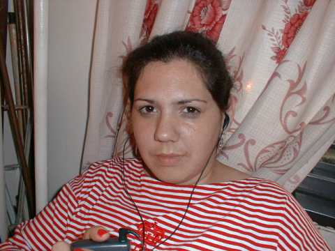 Picture of my wife Cecilia listening to music