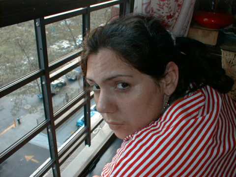 Picture of my wife Cecilia looking out the window