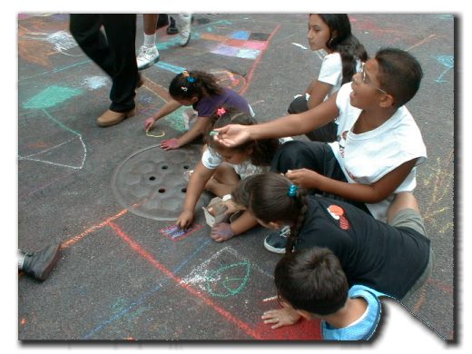 Picture of children enjoying themselves drawing on the street