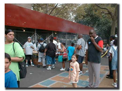 Picture of people lining up to get some food
