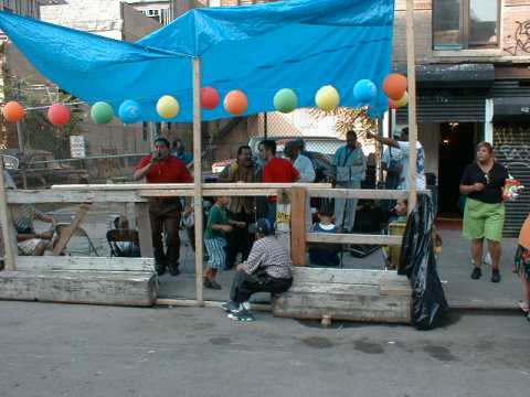 Picture of a Latino band playing out in the street