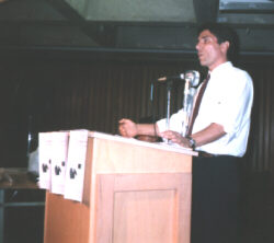 Nelson Denis addressing questions from audience at podium