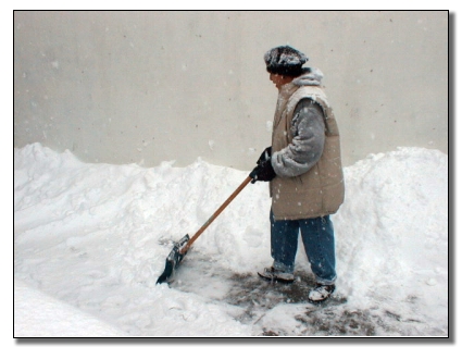 Picture of Home Owner begining to dig out from the storn