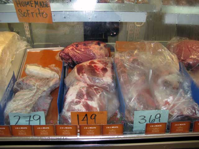 Jose's Meat Market freezer window showing some choice cuts of meat.