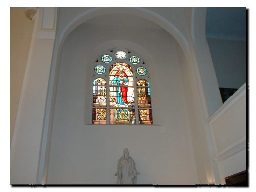 Picture of Stain Glass window depicting Jesus appearing before a Saint.