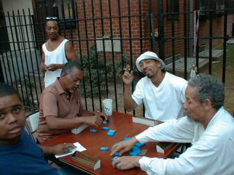 Another picture of resident playing dominoes